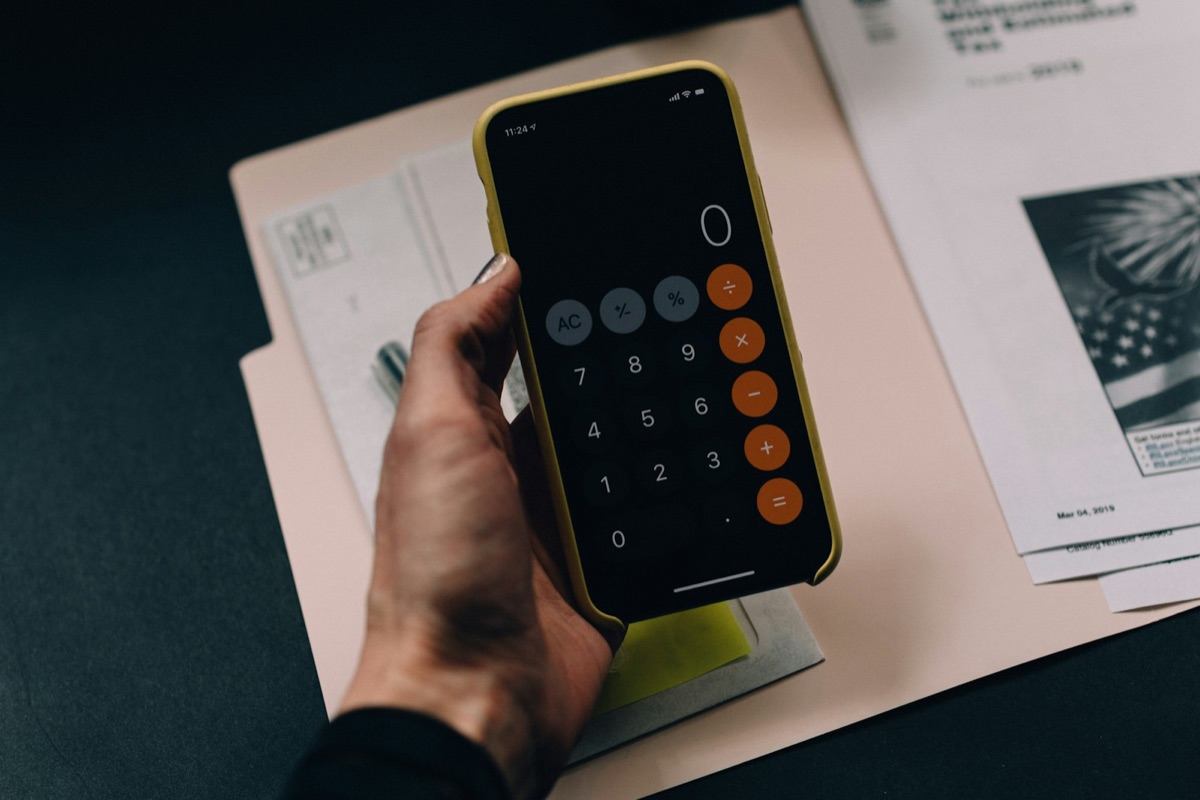 Accountant workspace with documents and calculator - bottleneck identified by AI audit